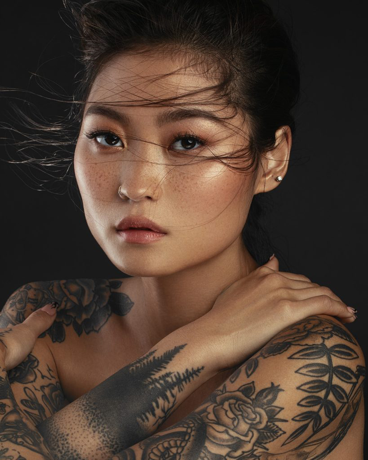 Photo of a woman with tattoos